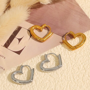 Vintage heart shaped earrings in gold and silver finish with elegant geometric design