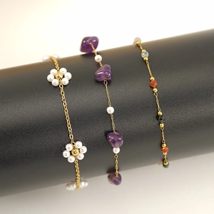 Three elegant titanium steel bracelets with pearls, purple natural stones and gold chains