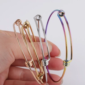 Detailed view of adjustable stainless steel wire bracelets in four metallic colors