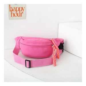 Detail of kids pink canvas waist bag featuring adjustable strap and woven zipper puller