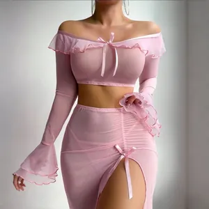 Detail of pink mesh two-piece set with ruffle neckline and delicate ribbon bow accents