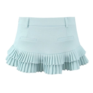 Detail of light blue tiered pleated mini skirt showing texture and double-layer design