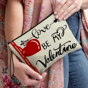Canvas Valentine's Day cosmetic bag with love heart print and black wrist strap