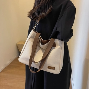 Minimalist canvas tote bag for women with large capacity and stylish brown shoulder straps