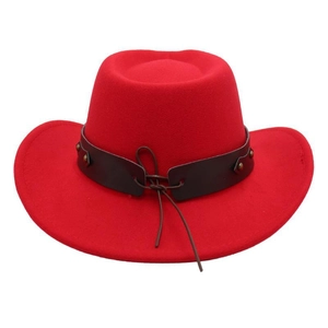 Detail view of a red wool felt cowboy hat with a studded brown leather hatband