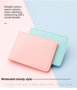 Detail view of pink and light blue ultra-thin leather card holders with lychee texture