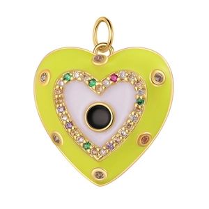 Detailed view of heart-shaped copper pendant with enamel finish and zircon cross inlay