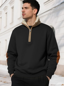 Detail of men's black quarter-zip sweatshirt with beige fleece lining and elbow patches