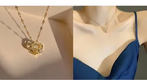 Macro detail of gold crown necklace with 520 engraving and crystal stones on fine chain