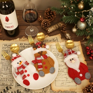 Christmas dinnerware set featuring Santa, snowman and reindeer felt cutlery holders