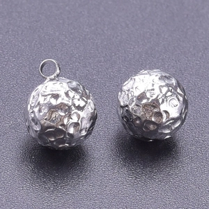 Macro shot of 304 stainless steel ball charms with irregular hammered texture for jewelry