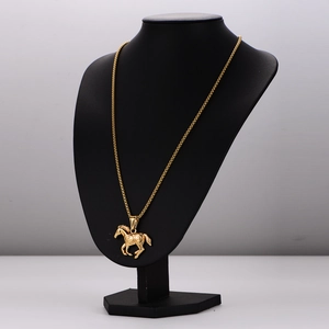 Vintage stainless steel gold horse pendant necklace displayed on a black neck mannequin