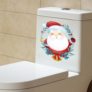 Detail of Christmas Santa Claus vinyl sticker applied to a white ceramic toilet tank