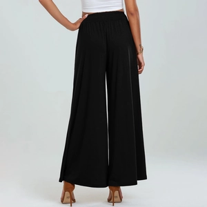 Detail view of high waist wide leg trousers with pleated design and soft fabric texture