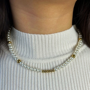 French style pearl and natural stone necklace worn by model on white knit sweater