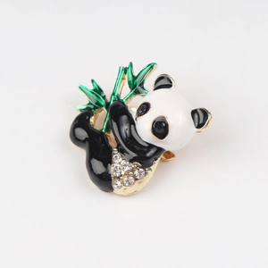 Charming panda brooch with green bamboo and sparkling crystals on golden metal base