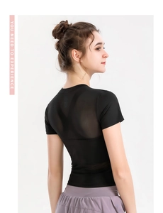 Detail view of breathable mesh back stitching on slim-fit women's dry-fit sports t-shirt
