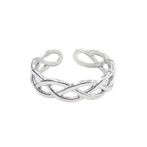 Polished stainless steel open ring featuring a unique woven texture and adjustable design