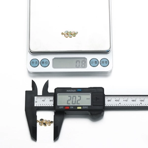Gold stainless steel leaf pendant charm with enamel fill measuring 20.2mm and 0.8g weight
