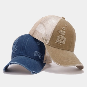 Distressed vintage baseball caps in navy and khaki with mesh breathability and torn edges