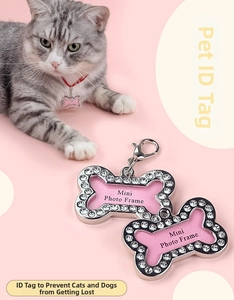 Sparkly pink bone-shaped pet ID tag with crystal trim and lobster clasp for dogs