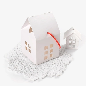 White house-shaped kraft paper gift box with red handle and hollow window design