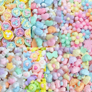 Colorful macaron resin charms in flower star and heart shapes for DIY nail art and crafts