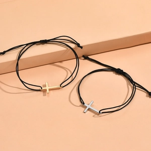 Minimalist adjustable black cord couple bracelets with gold and silver cross pendants