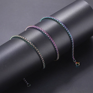 Detailed close-up of a rainbow plated stainless steel box chain necklace with lobster clasp