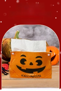 Detail of Halloween pumpkin tissue box cover made of orange felt with snap closure