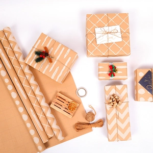 Classic brown kraft gift wrapping paper rolls with white dot and wave patterns