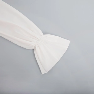 Detail of white chiffon flare sleeves with elastic ruffled cuffs for a light summer dress