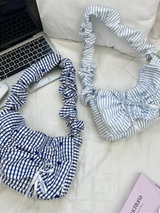 Pleated striped handbag with white ribbon bow and ruched wide handle for daily commute
