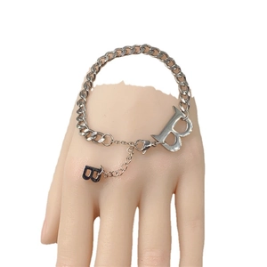 Silver thick chain bracelet with B-letter charms in a polished finish on a white background