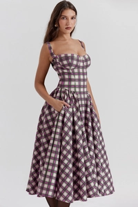 Detailed front view of a purple and green plaid sundress with a fitted bodice and long skirt