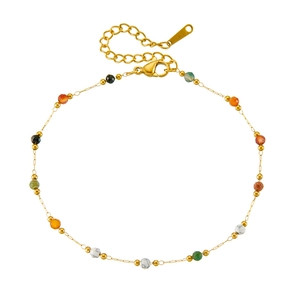 Detail of gold stainless steel anklet with colorful stone beads and lobster clasp