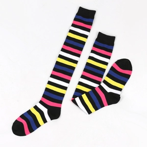 Detail showing colorful striped over-the-knee cotton socks in rainbow patterns