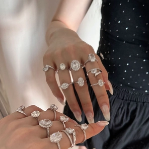 Detailed view of luxury S925 sterling silver geometric oval rings on model's hand