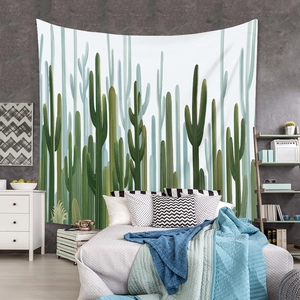 Detail of bohemian cactus tapestry hanging on a bedroom wall for a fresh interior decor
