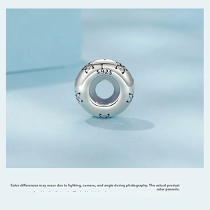 Macro view of S925 sterling silver star charm bead with sparkling cubic zirconia inlay