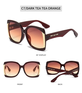 Detailed views of square oversized sunglasses with gradient tea lenses and gold metal accents