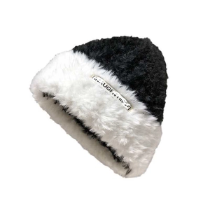 Winter plush knit hat in black and white contrast faux fur with LAUGHING metal tag