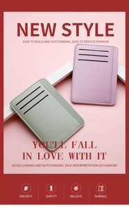 Detail view of slim lychee grain PU leather card holders in sage green and lilac colors