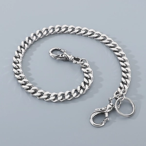 Detailed view of silver titanium steel hip hop cuban link trousers chain with skull lobster clasps