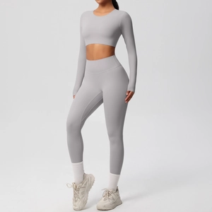 Close-up of seamless light grey nylon athletic yoga set with crop top and leggings