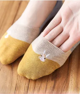 Detail view of elastic cuff on women's knit invisible socks with rabbit embroidery