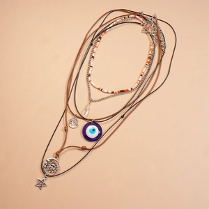 Bohemian multi-layer necklace set with evil eye, tree of life, and celestial charms