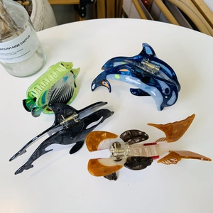 Marine life acetic acid hair claws featuring whale and dolphin designs in colorful resin
