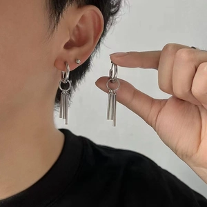 Industrial titanium steel earrings with three hanging cylindrical pendants in silver