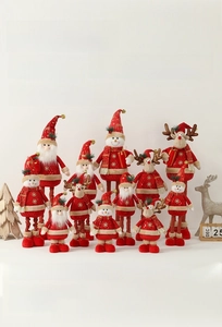 Detail showing plush Christmas figures with gold snowflake embroidery and red knit fabric